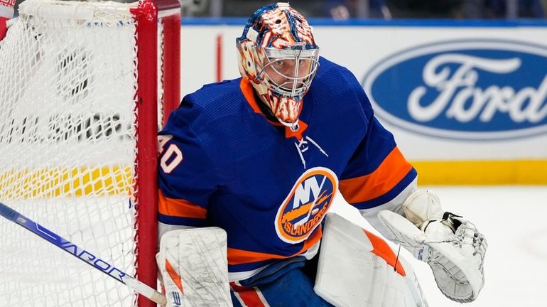 Islanders goaltender Semyon Varlamov watches the puck curing the third...