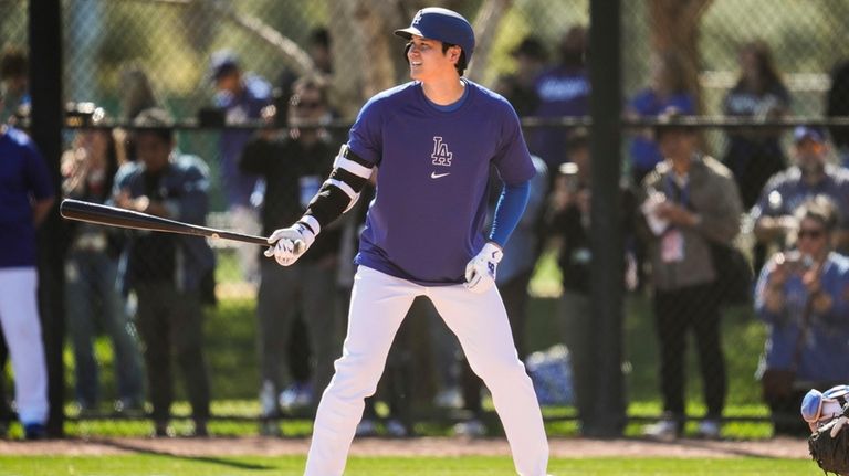 Los Angeles Dodgers designated hitter Shohei Ohtani participates in spring...