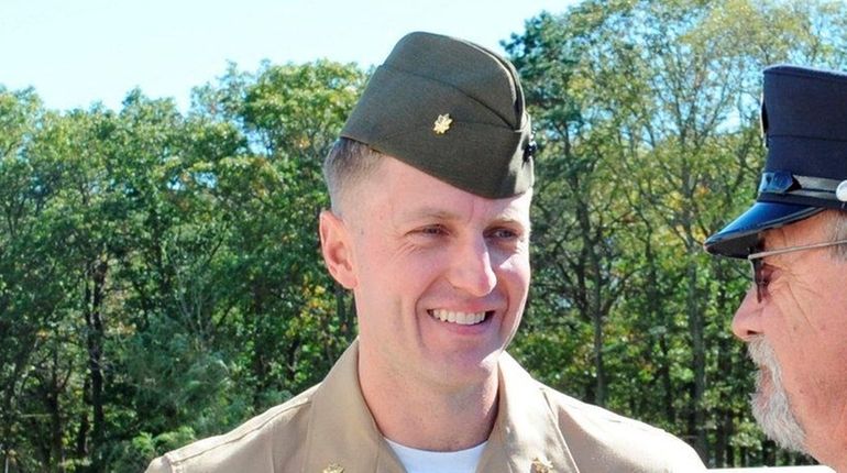 Marine major Jason Brezler, left, in front of federal court...