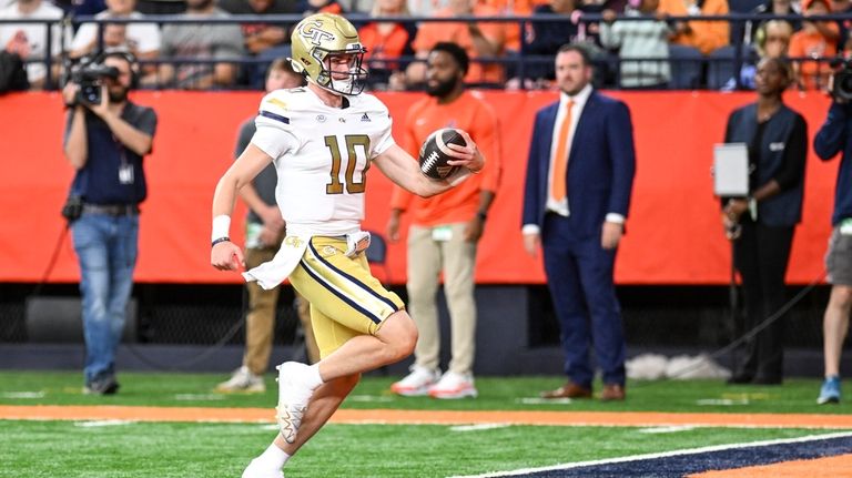 Georgia Tech quarterback Haynes King (10) runs for a touchdown...