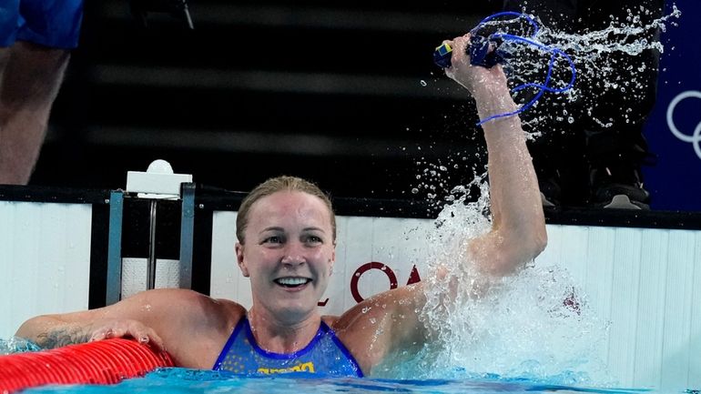 Sweden's Sarah Sjoestroem celebrates after winning the gold medal in...