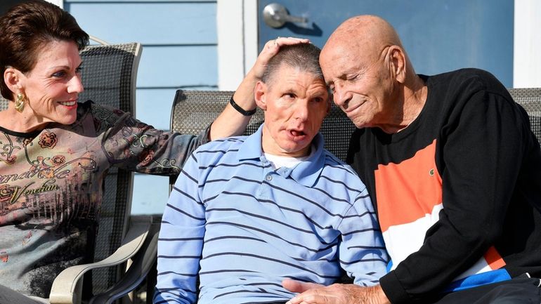 Ricky Weisenberg, center, with his father, former Long Beach state...