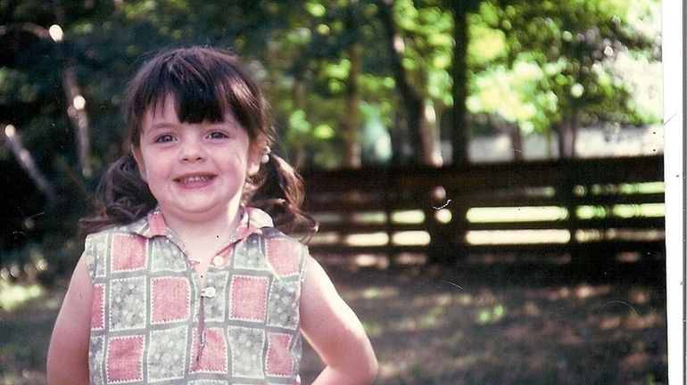 Patricia Curran Sorrentino in her family's Bellmore yard around 1970....