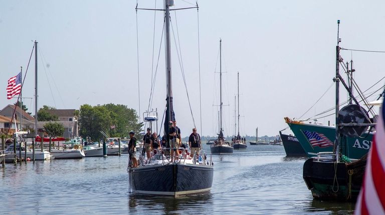 U.S. Naval Academy midshipmen arrive at the Nautical Mile in...