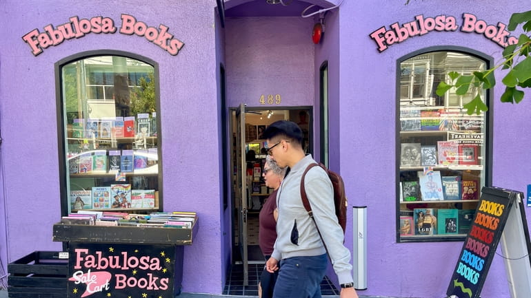 Pedestrians walk past the Fabulosa Books store in San Francisco's...