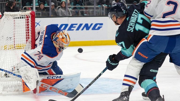 Edmonton Oilers goaltender Stuart Skinner (74) makes a save on...