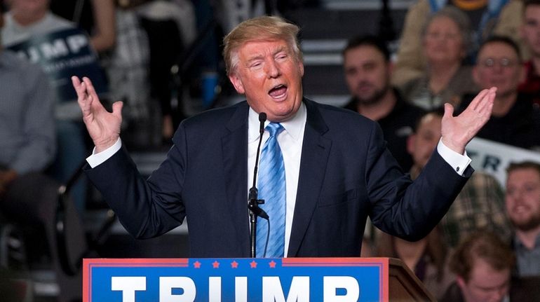 Republican presidential candidate Donald Trump addresses supporters during a campaign...