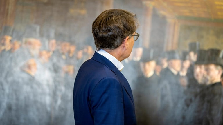 CEO of Dansk Erhverv Brian Mikkelsen looks at artworks saved...