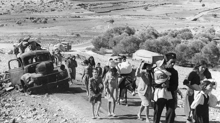 Arab villagers who fled from their homes during fighting between...