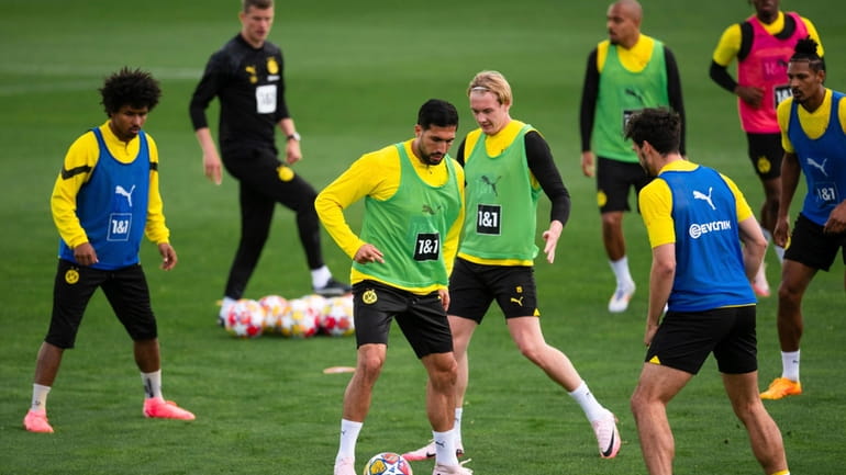 Borussia Dortmund's Emre Can, third from left, and Julian Brandt,...