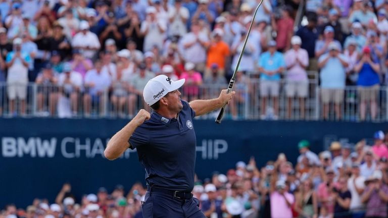 Keegan Bradley celebrates on the 18th green after winning the...