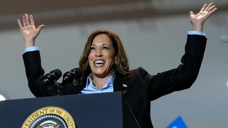 Democratic presidential nominee Vice President Kamala Harris campaigns with President...