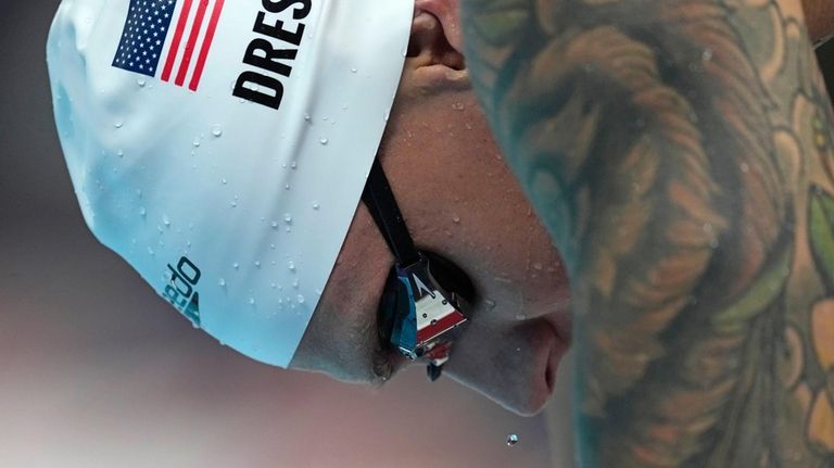 Caeleb Dressel of United States, warms up ahead of the...