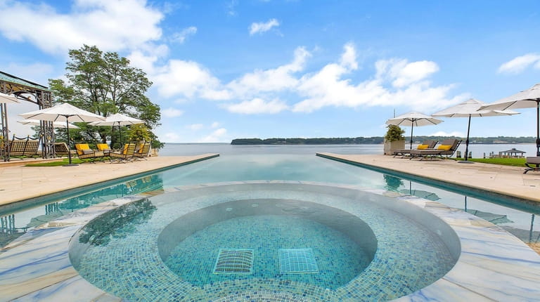 The infinity pool at a Kings Point home listed for...