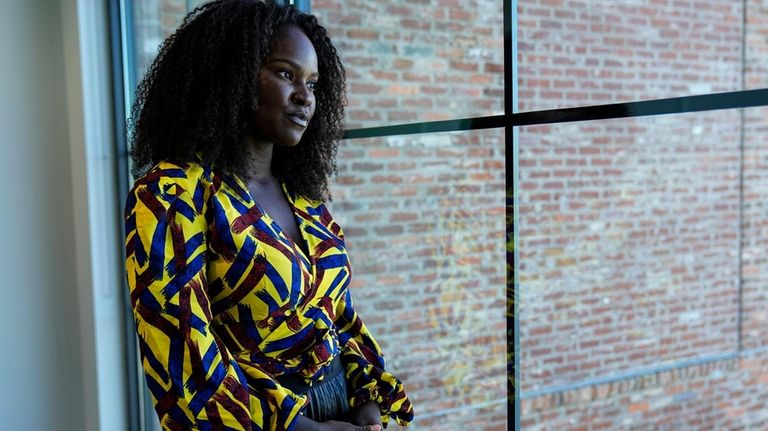 Sophia Danner-Okotie poses for a portrait in her shared workspace...