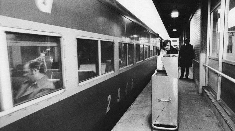 A porter wheels a bar cart at the Babylon train...