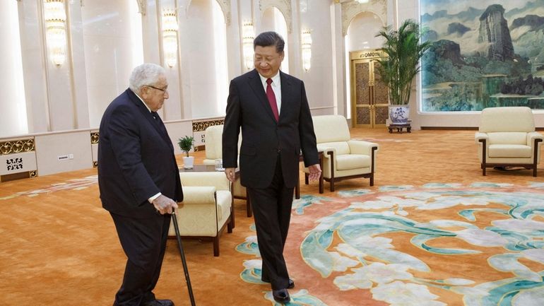 Chinese President Xi Jinping, right, meets with former U.S. Secretary...