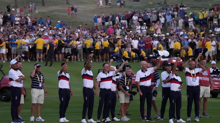 Members off the United States Ryder Cup team cheer United...