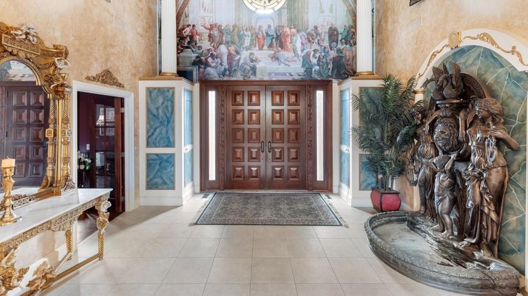 The Shore Drive house has mahogany doors that welcome people...