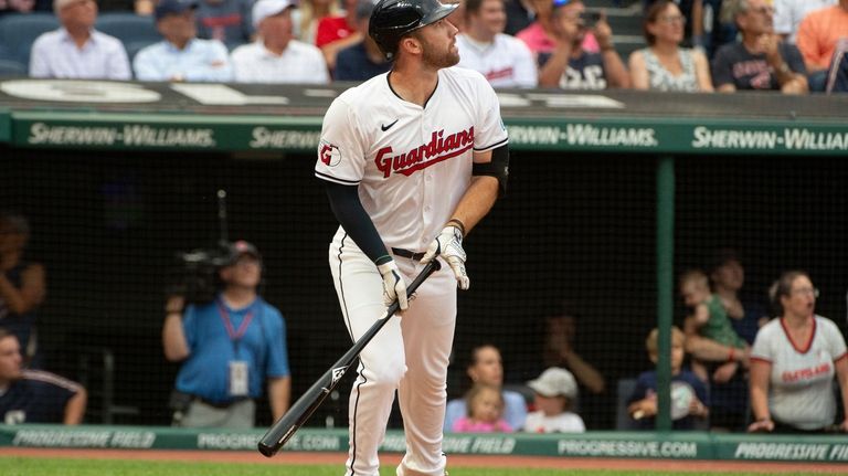 Cleveland Guardians' David Fry watches his three-run home run off...