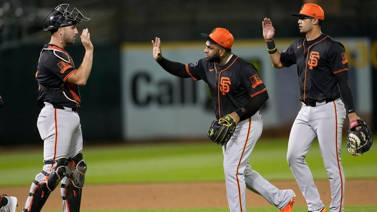 San Francisco Giants' Joey Bart, from left, celebrates with Pablo...