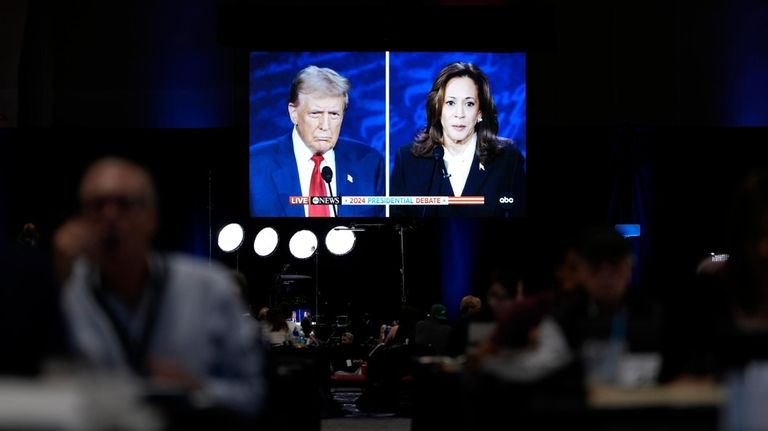 Members of the press appear in the spin room during...