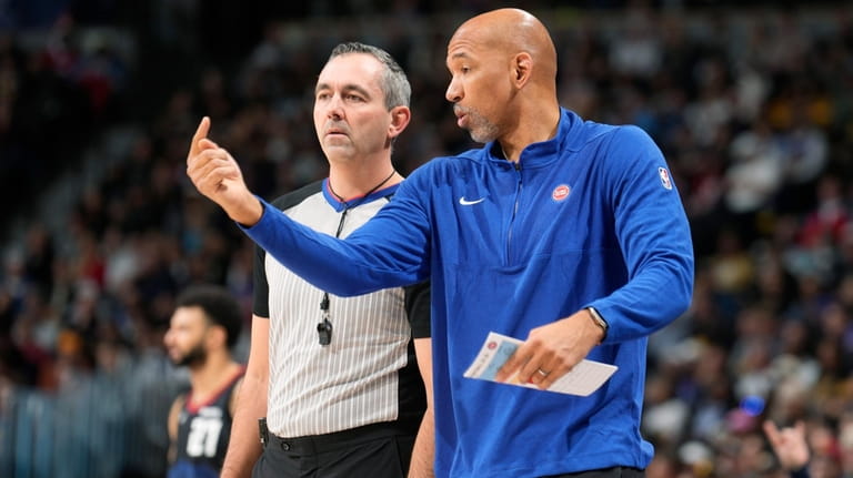 Detroit Pistons head coach Monty Williams, right, argues for a...