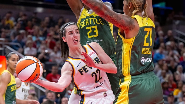 Indiana Fever guard Caitlin Clark (22) passes the ball from...