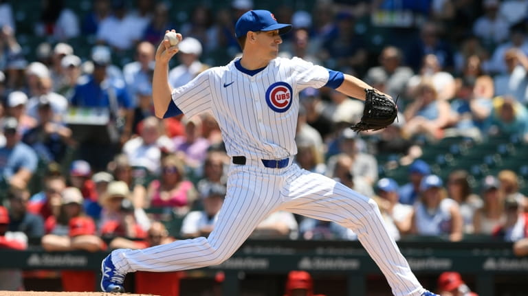 Chicago Cubs starter Kyle Hendricks delivers a pitch during the...