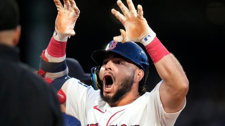 Boston Red Sox's Wilyer Abreu reacts after his RBI single...