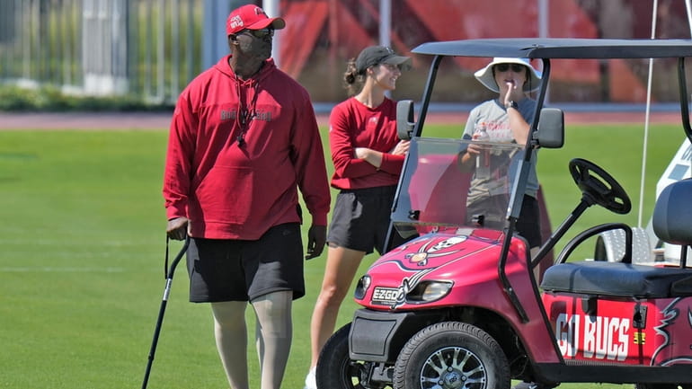Tampa Bay Buccaneers head coach Todd Bowles walks with a...