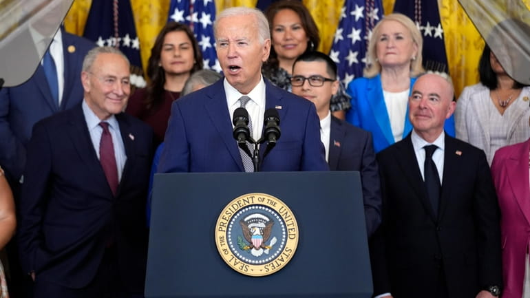 President Joe Biden speaks during an event marking the 12th...