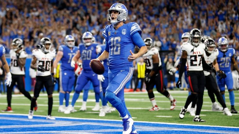 Detroit Lions quarterback Jared Goff (16) scores a touchdown against...