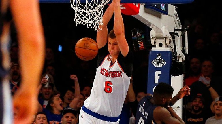 Kristaps Porzingis #6 of the New York Knicks dunks the...