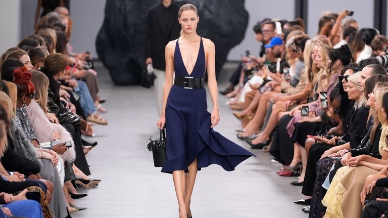 A model walks the runway during the Michael Kors Collection...