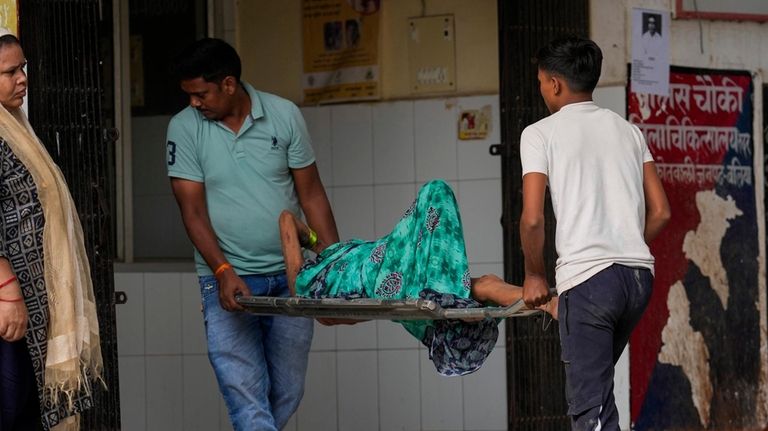 An elderly woman suffering from heat related ailment is brought...