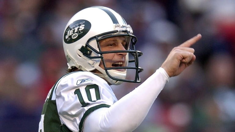 Chad Pennington signals a teammate during a game against the...