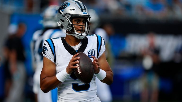 Carolina Panthers quarterback Bryce Young (9) warms up before a...