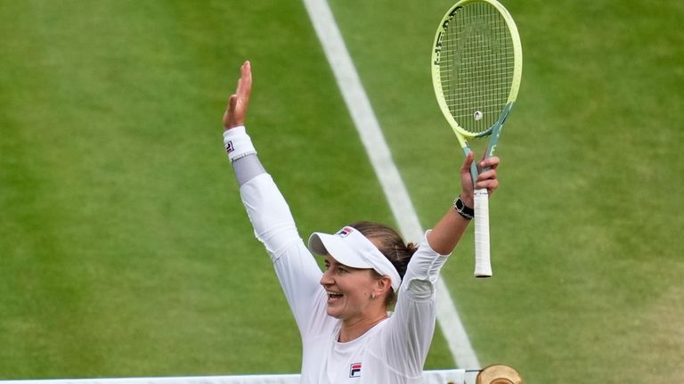 Barbora Krejcikova of the Czech Republic celebrates after defeating Elena...