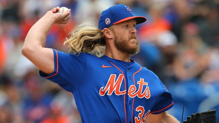 Mets pitcher Noah Syndergaard delivers a pitch against the Astros during...