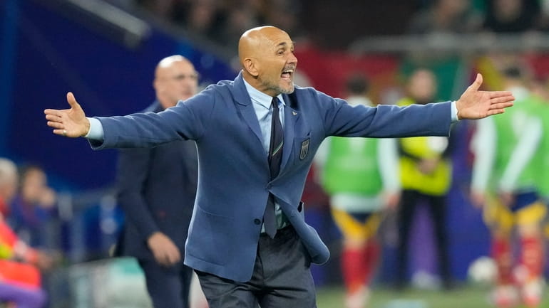 Italy's head coach Luciano Spalletti gives instructions from the side...
