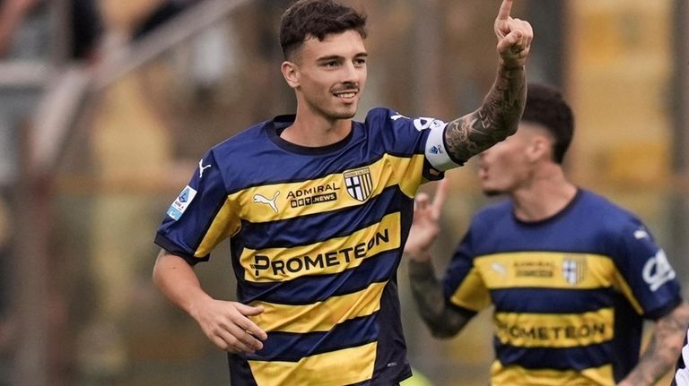 Parma's Enrico Del Prato celebrates after scoring their side's first...