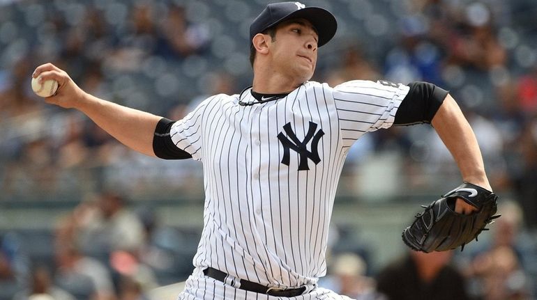 New York Yankees starting pitcher Luis Cessa delivers a pitch...