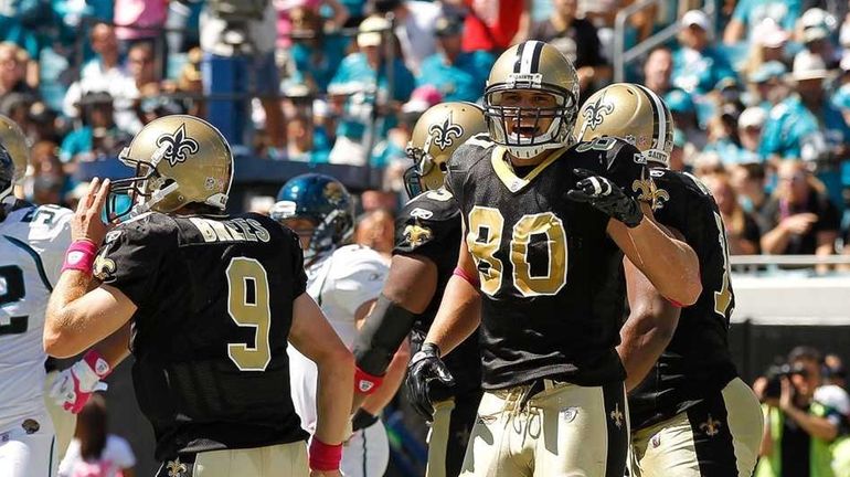 Jimmy Graham #80 of the New Orleans Saints celebrates after...