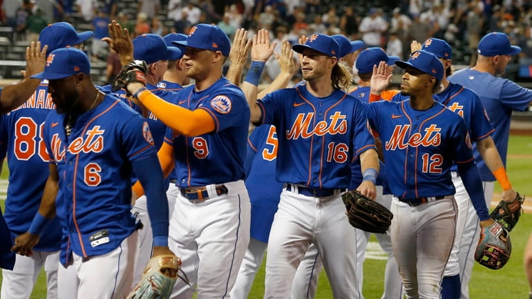The Mets celebrate after defeating the Yankees at Citi Field on Tuesday.