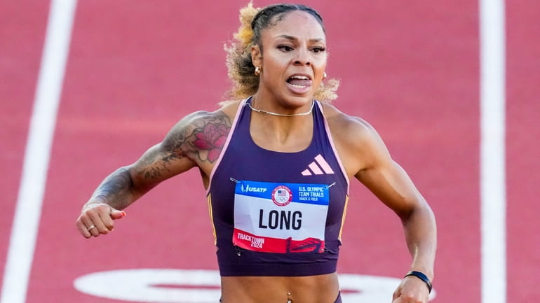McKenzie Long wins a heat women's 200-meter semi-finals during the...