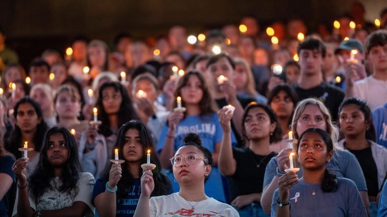 University of North Carolina-Chapel Hill students, faculty and family hold...