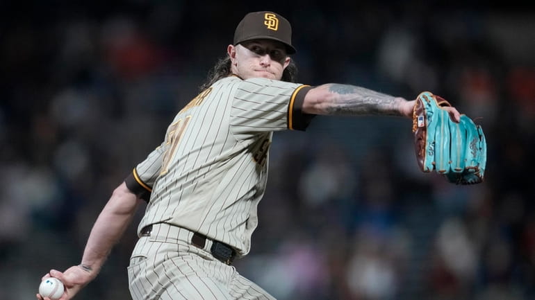 San Diego Padres' Josh Hader winds up during a baseball...