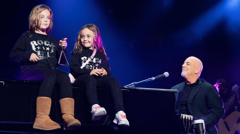 Billy Joel with daughters Della and Remy at Madison Square Garden...