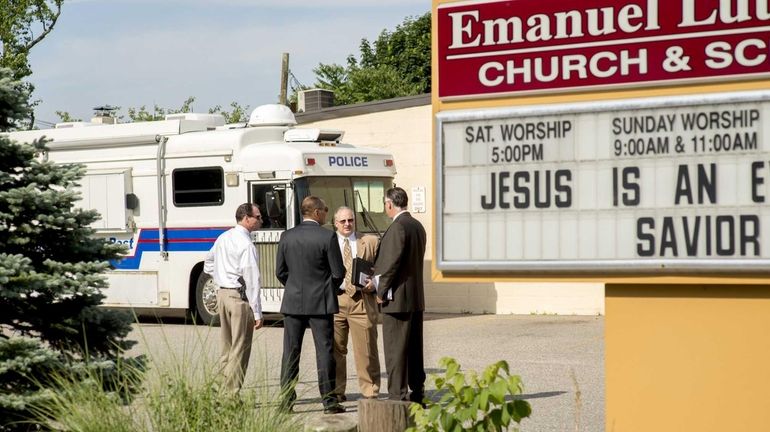 Police investigate a homicide at a Church on Main St....